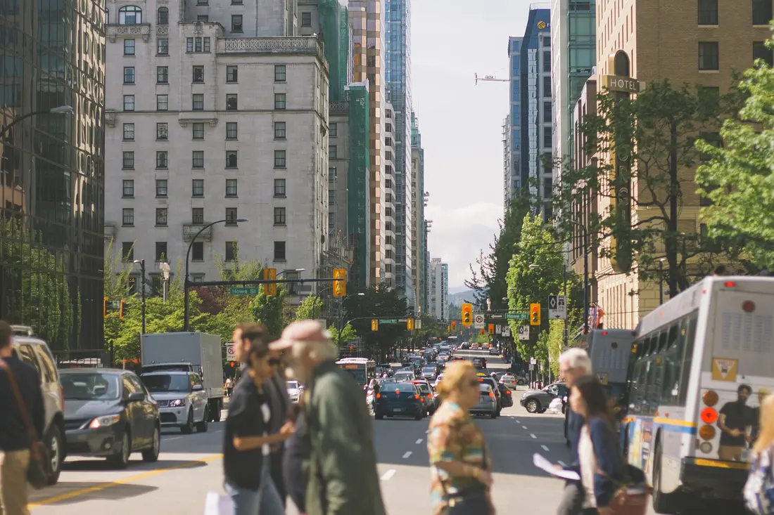 A city crosswalk with the people and cars boxed and labelled