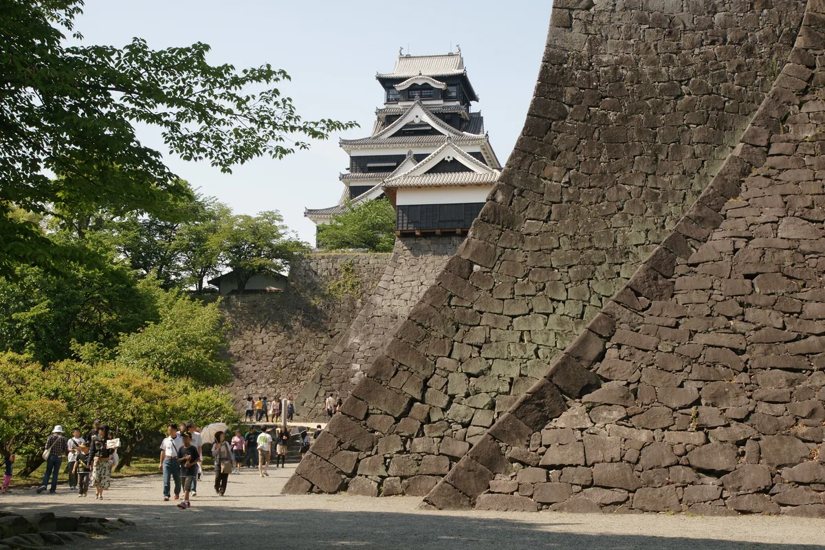 Kumamoto Castle with a crowd of tourists in front, before they are erased